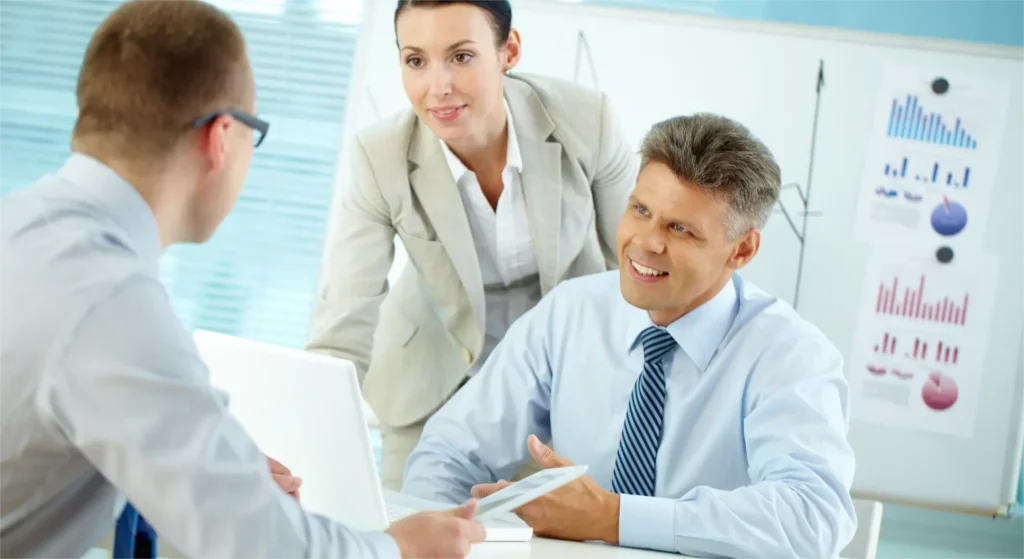 Medical device executive discussing regulatory affairs recruitment strategy with quality assurance and FDA compliance teams