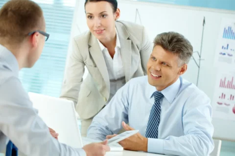 Medical device executive discussing regulatory affairs recruitment strategy with quality assurance and FDA compliance teams